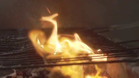 Ear of corn falls on metal grid with barbecue. Slow motion video Stock Footage 114551907