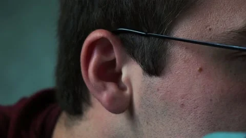 Ear of a man lying on a bed close-up Stock Footage 158395238