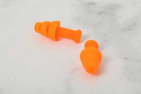 Ear plug pair on white background loss sound Stock Photos