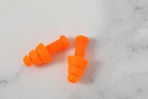 Ear plug pair on white background loss sound Foto stock