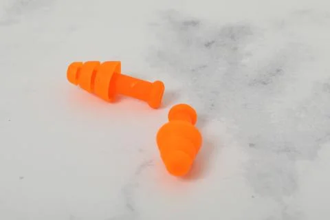 Ear plug pair on white background loss sound Stock Photos