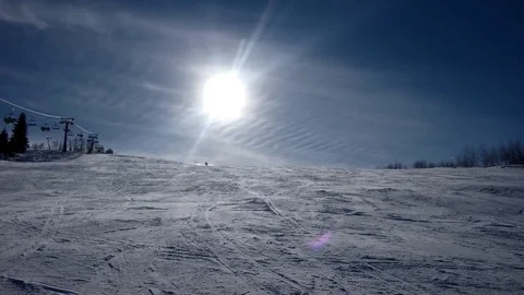 Ear View of Professional Skier Carving Down the Snowy Slope 動画素材 72102364