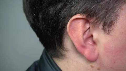 The ear of a young man in close-up Stock Footage 168687440