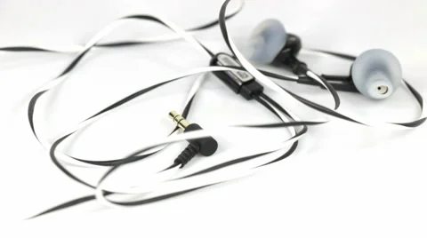 Earbuds rotating on white background Stock Footage 40388382
