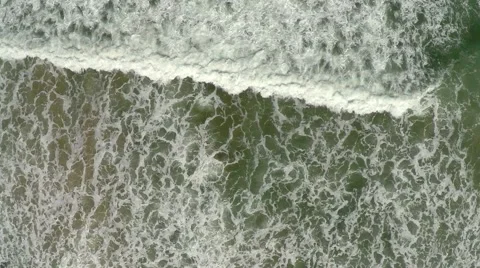 Earial view of ocean waves crashing on the rocks and shore Stock Footage 50809047