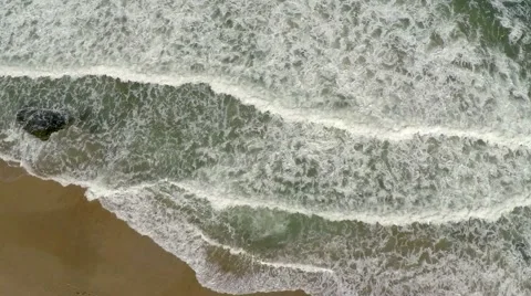 Earial view of ocean waves crashing on the shore Stock Footage 50809157