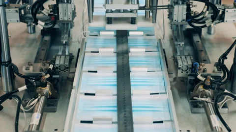 Earloop attaching machine at a medical mask making facility. Protection medical Video stock 144243006