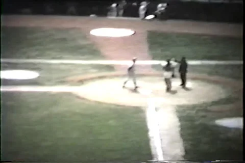 Early 1960's baseball game, pitcher swings, infield throw ball around Video stock 36089558