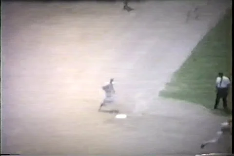 Early 1960's baseball game, runner rounds first, stops at second Video stock 36089079