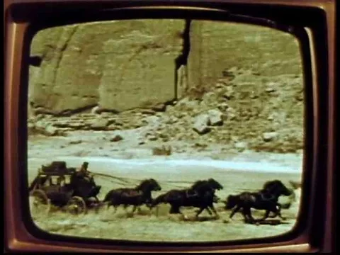 Early 60s safety dramatization with a family watching a western television show Stock Footage 75331626