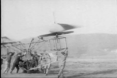 Early Aviation - Failed Vintage Flying Machine - Men move plane into position Stock Footage 140072989