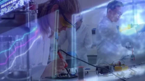Early-career engineer assembling circuit with soldering iron analyzing data Stock Footage 317265384