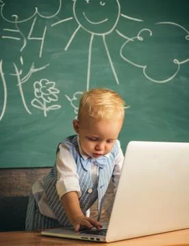 Early development with new technology. Little boy learn using computer Stock Photos