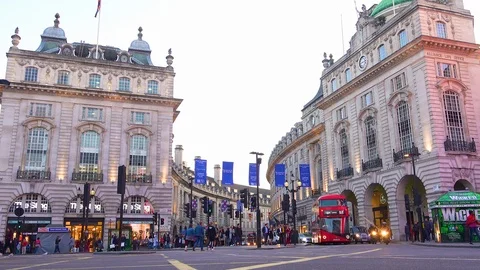 Early evening doubledecker bus and London taxi traffic moves through Piccadilly Stock Footage 107444090