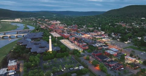 Early evening spring, summer aerial video of area around Corning New York Stock Footage 231746792
