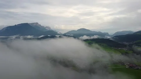 Early Morning Drone Descent Through Clouds Over Schönau am Königssee Stock Footage 289009155