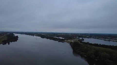Early Morning Drone Flight Over Wide River with Calm Water Stock Footage 328539704