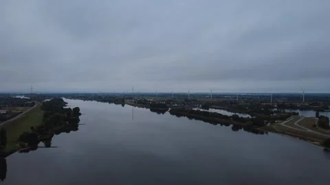 Early Morning Drone Flight Over Wide River with Calm Water Stock Footage 328540156