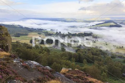 Early morning fog around Curbar village, from Curbar Edge, Peak District Stock Photos