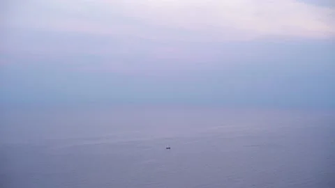 The early morning light with tiny boat floating alone Stock Footage 221214729