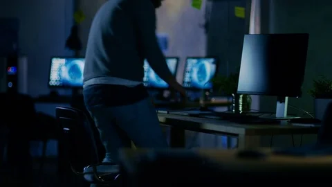 On a Early Morning Mobile Application Developer Sits at His Desk and Starts Work Stock Footage 79443004