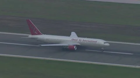 Early Morning OmniAir 767 Takeoff Track Stock Footage 59883976