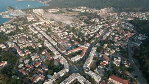 Early morning over the architecture of a small town by the sea, drone 4k Stock Footage 214907764