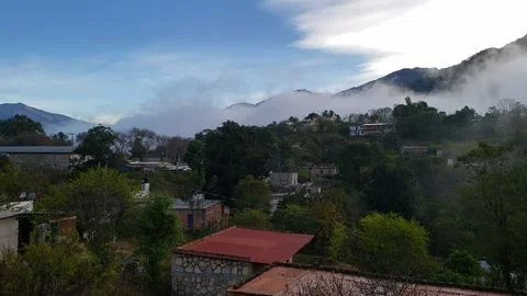 Early morning in rustic setting panning L to R from blue sky to heavy cloud Stock Footage 156217365