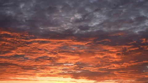 Early morning scenic dramatic cloudscape with colourful orange and purple clouds Stock Footage 219395201
