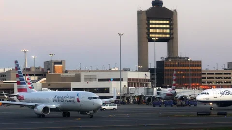 Early morning shot of an american airlines jet taxiing at boston airport Stock Footage 85872336