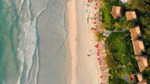 Early morning sunlight casting over the beach flyover shot Stock Footage