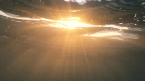 Early morning sunrays pierce the surface underwater Stock Footage 256586278