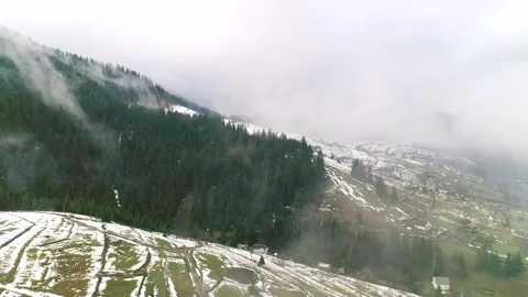 Early spring in mountain, first green grass on meadows Stock Footage 281342094