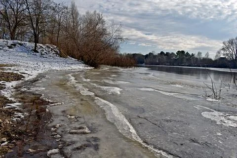 Early spring. A river breaking free from ice. Flood. Stock Photos