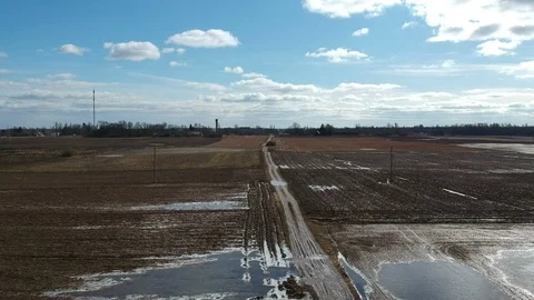 Early spring time bad wet dirty rural road, aerial Stock Footage 94726037