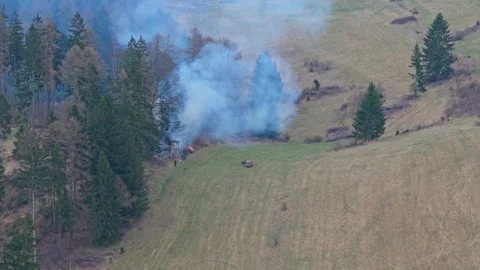 Early stage forest fire near hunting tower captured from drone with burning.. Stock Footage 333338391