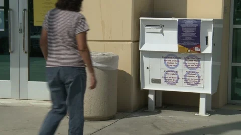Early Voting: Mail In Ballot Drop Off: 2020 Election Stock-Footage 141390932