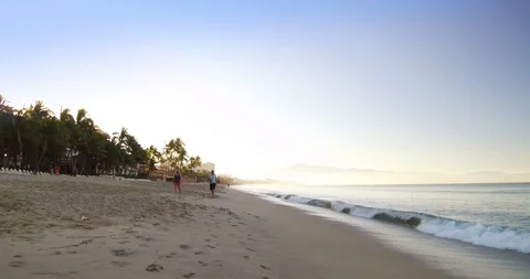 Early walk on the beach.  Stock Footage 102689419