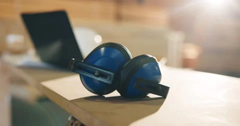 Earmuffs, carpentry and workshop with safety equipment, woodwork and noise Stock Footage 341388778