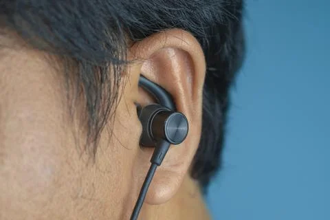 Earphone in ear Stock Photos