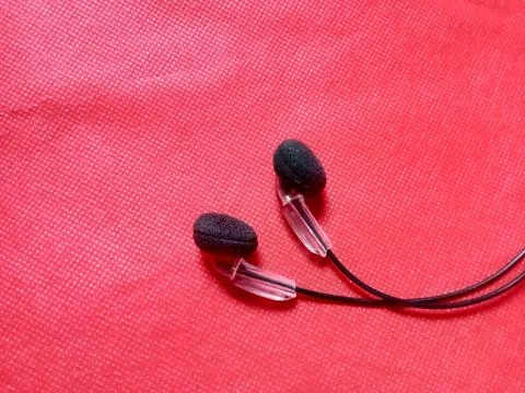 Earphone on red background  Stockfoto's