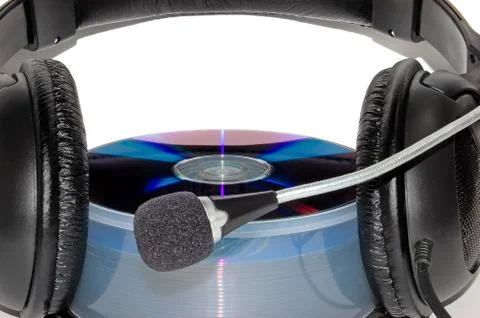 Earphones on to of a CD Foto stock