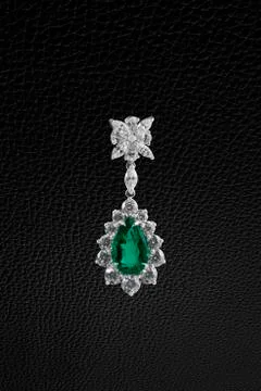Earring on black Stock Photos