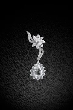 Earring on black Stock Photos