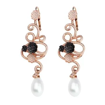 Earring on white Stock Photos