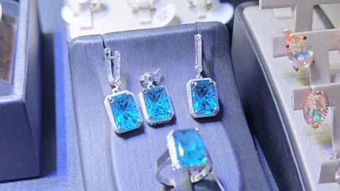Earrings and rings displayed at a local market stall. Stock Footage 340162971