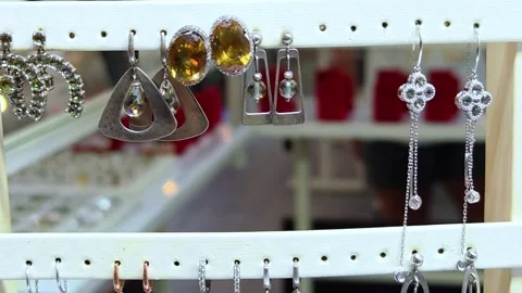 Earrings and rings displayed at a local market stall. Stock Footage 340327729