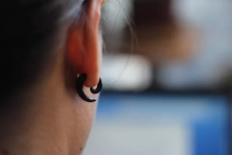 Earrings in the ear Stock Photos