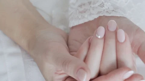 Earrings in the hand of the bride close-up Stock Footage 73290990