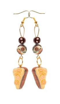 Earrings made of plastic in the form of the cake with lemon Stock Photos